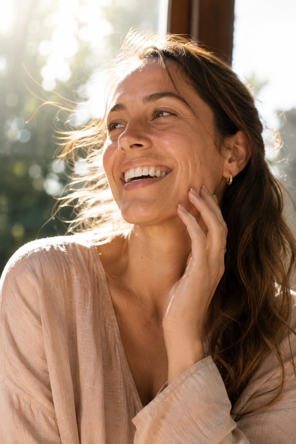 Happy model in warm sunlight, representing the LivWell mission